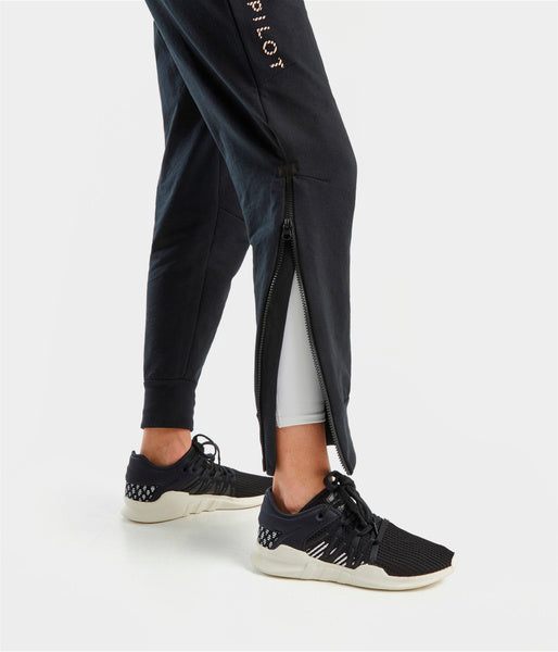 TEAM PANTS • sur-pantalon jogging femme